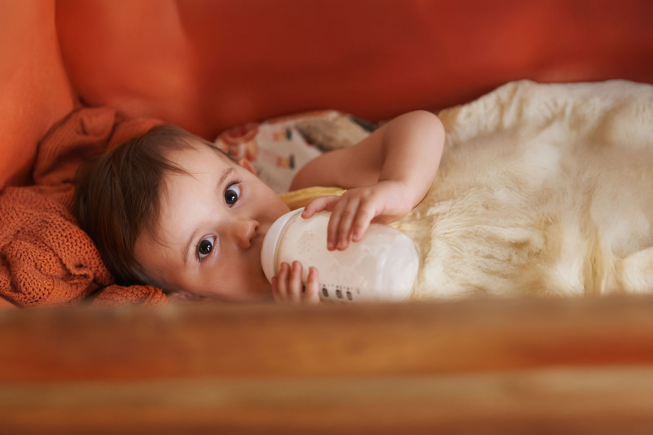 Baby drinking from bottle for blog
