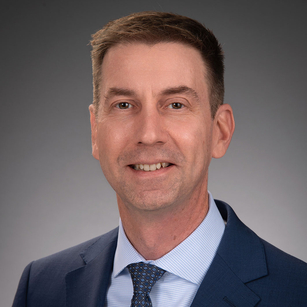 This is a formal picture of Aaron Carpenter, DNP, M.Div., APRN, CPNP-PC, Senior Vice President, Chief Nursing and Patient Operations Officer, Delaware Valley.