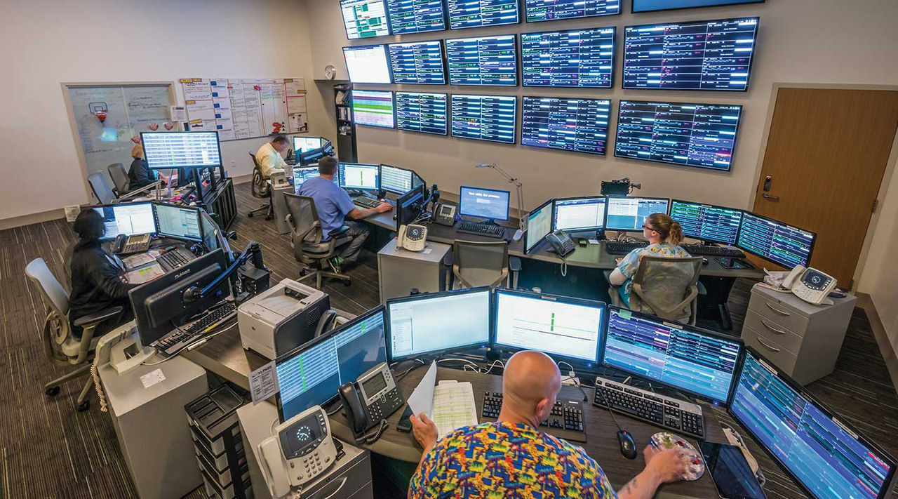 Health care is changing in delivery and in technology and here people in scrubs worn in a room filled with computer workstations and patient monitors.