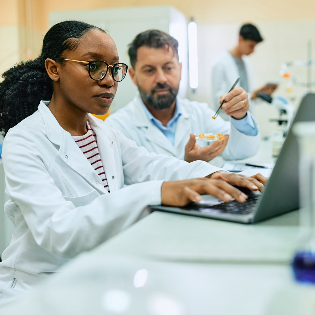 Lab techs on computer