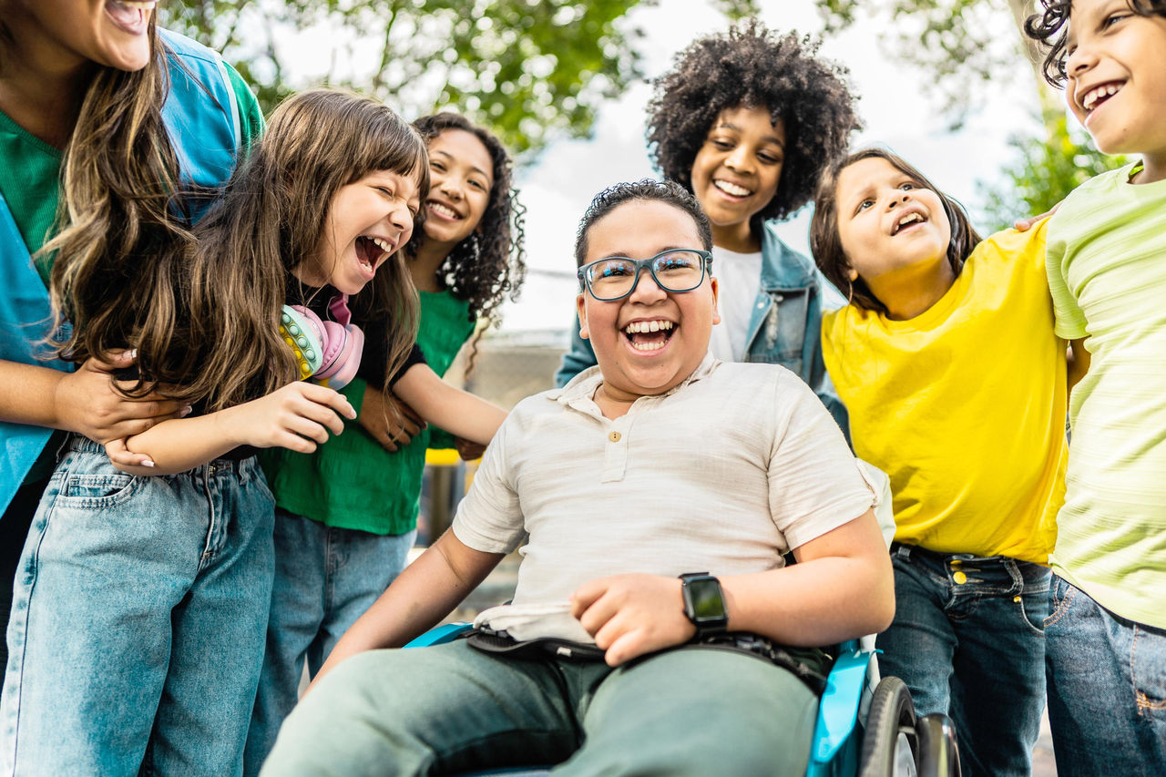 Teen boy athlete jumping in gym during physical therapy with a female provider