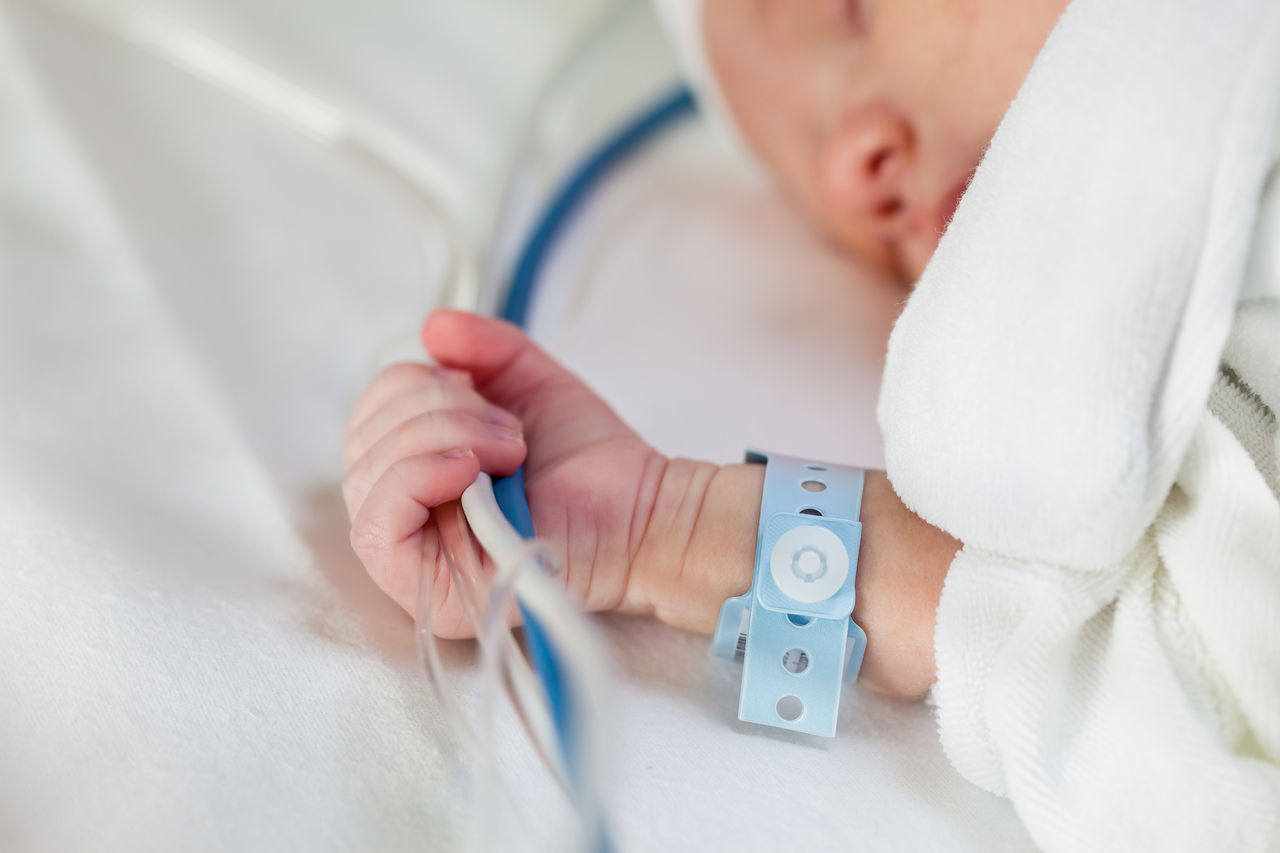 Closeup of an infants hand in the NICU.