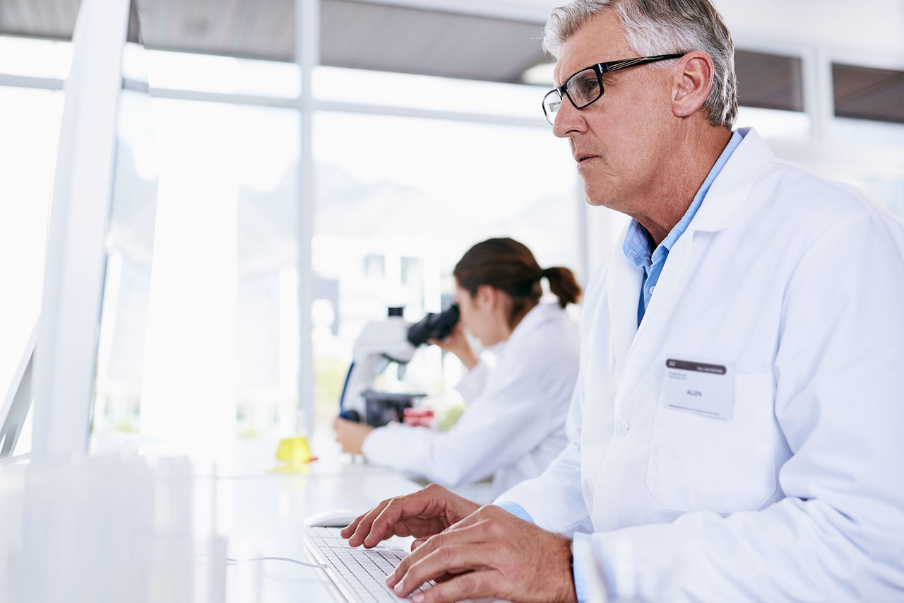 Doctor typing on computer