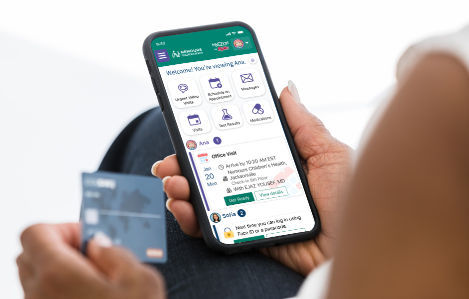Woman holding an iPhone using Nemours Children's MyChart.