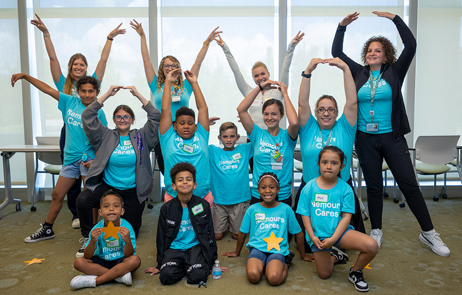 Group of children posing for cochlear implant summer camp