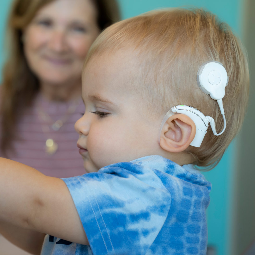 Boy with cochlear implant