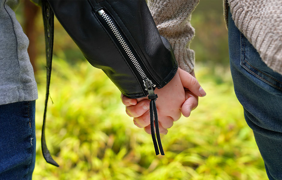 Smiling mom and smiling preschooler look at laptop